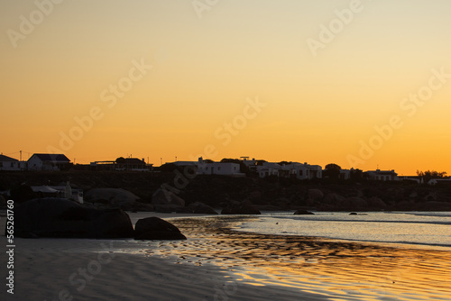 On the beach of Paternoster during sunset, orange sky, water, evening, Western Cape, South Africa