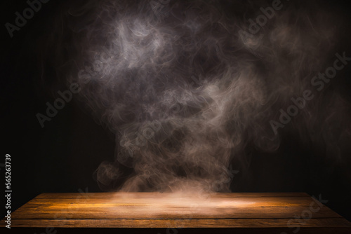 empty wooden table with smoke float up on dark background  wallpaper  web  social media app.