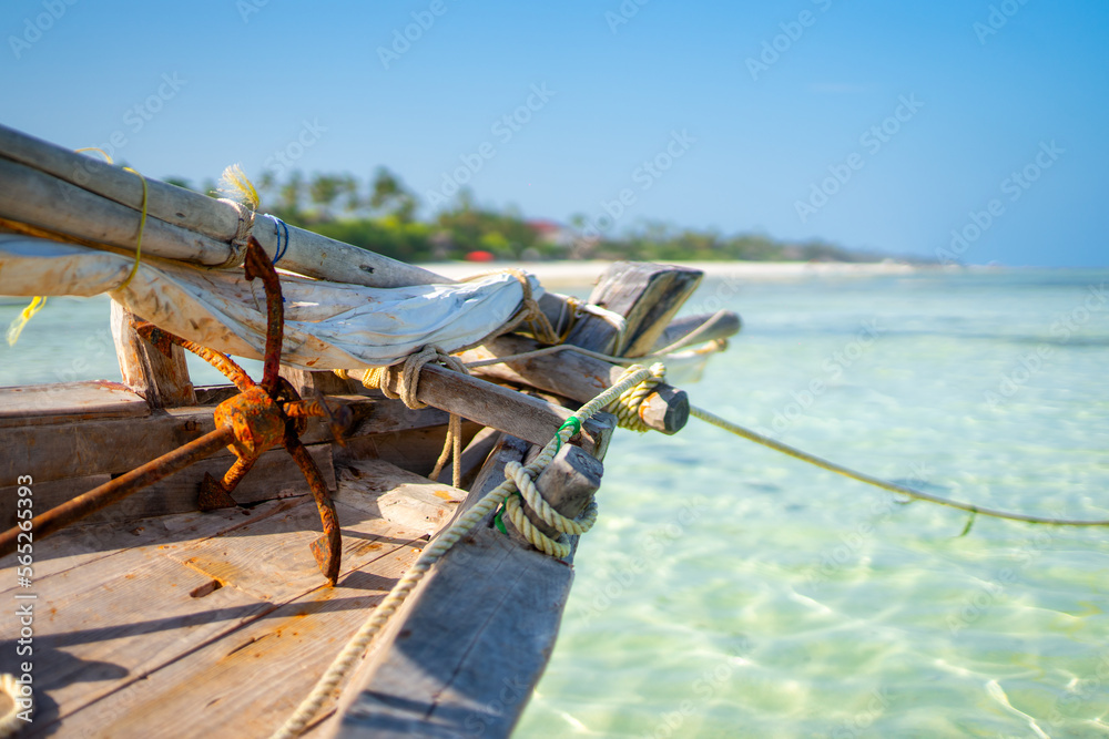 Dhow Fishing Boat at low tide on Zanzibar island, Tanzania - obrazy, fototapety, plakaty 