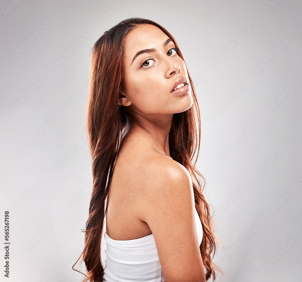 Portrait, serious and woman in studio for hair, beauty and salon treatment on grey background. Face, haircare and model relax with luxury, hair care and shine, keratin and smooth results isolated