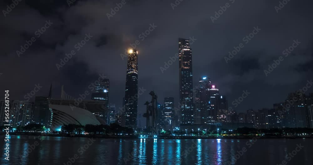 Timelapse of Guangzhou city at night. Skyscrapers, office buildings, business area. Clouds are moving fast Timelapse of Guangzhou city at night. Skyscrapers, office buildings, business area. Clouds are moving fast