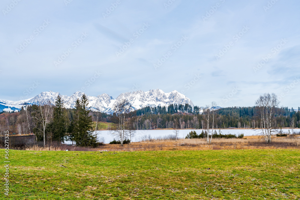 Wintry landscape with view of Alps near Schwarzsee lake in Kitzbuhel. Winter in Austria