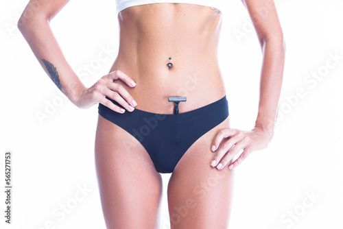 Female Healthcare Ideas. Caucasian Slim Woman With Perfect Fit Body While Putting Off Black Tonga Thong Off Her Buttocks With Manual Shaver Inside Over White © danmorgan12