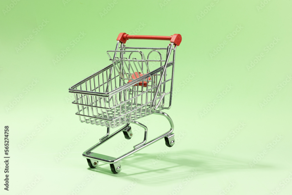 Shoping cart on green background