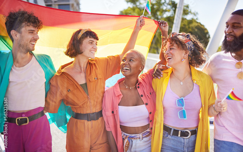 Festival, city and happy lgbt friends with rainbow flag for support, queer celebration and parade for solidarity. Diversity, lgbtq community and people enjoy freedom, happiness and pride identity photo