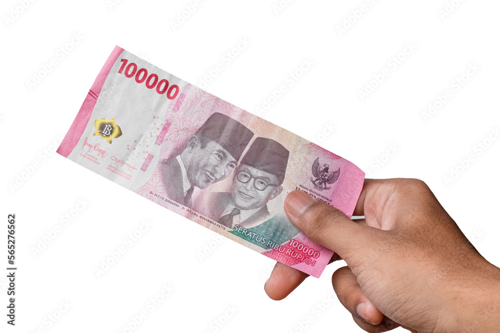 hand holding IDR 100,000 rupiah note isolated on white background. hand holding IDR 100,000 rupiah note isolated on white background.