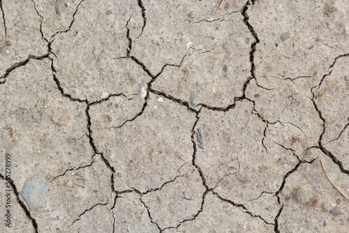 The ground has cracks in the top view for the background or graphic design with the concept of drought and death
