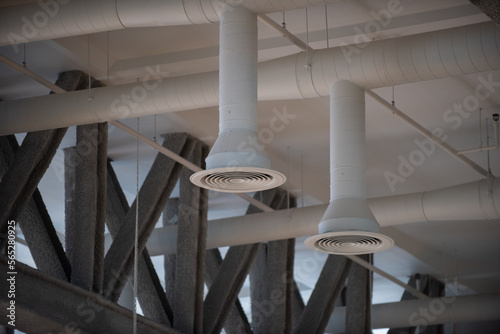 White round air duct. Air Condition pipe line and ventilation system in a school sport hall.	
