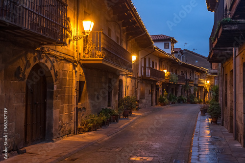 Beautiful village of Cartes illuminated at night, in Cantabria, Spain.
