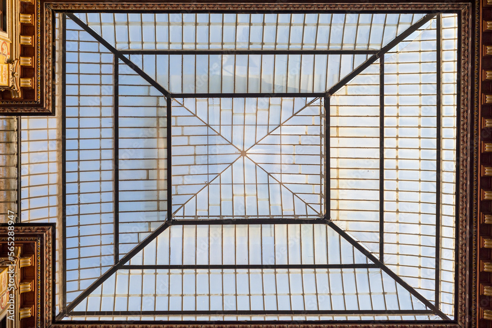 The glass roof of the building in Rome seen from the inside. Architecture, building, facades.