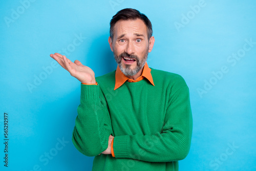 Photo portrait of mature handsome man arguing irritated face annoyed raise palm wear trendy green garment isolated on blue color background