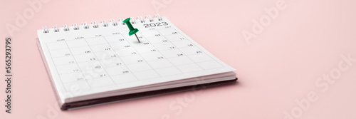 Calendar 2023 with pinned date on pastel pink background
