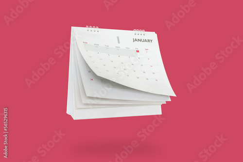 Foto White paper desk calendar flipping page mockup isolated on red background