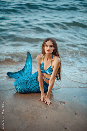 Foto Mermaid on the background of the waves