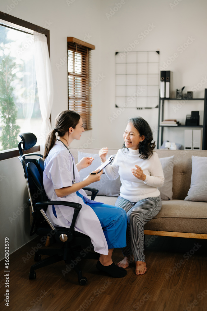 medical doctor holing patient's hands and comforting her.Kind doctor giving real support for patient. In home