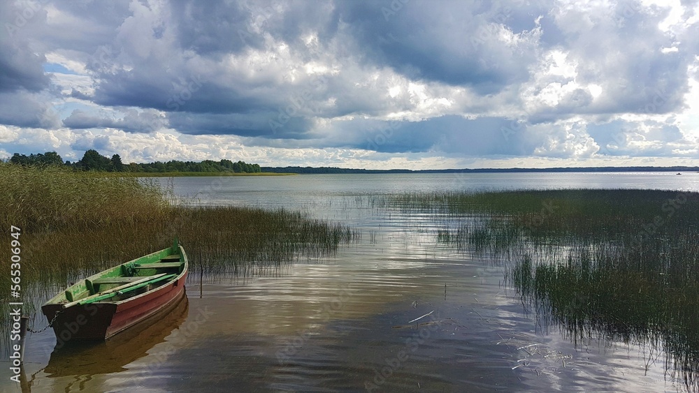 boat on the lake, cloudy sky boat on the lake, cloudy sky