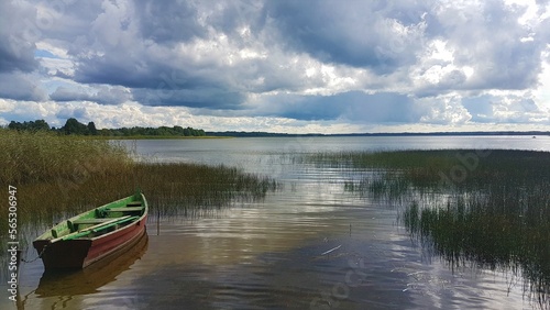boat on the lake, cloudy sky
