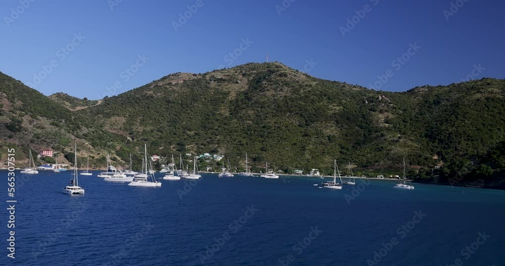 Jost Van Dyke British Virgin Islands marina bay sailboats recreation. British Virgin Islands. Stop for Caribbean boaters and cruise tourists. Tourism and yachting mainstay of economy. Tropical beach.