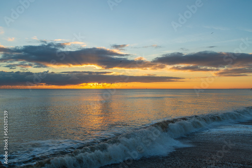 The sunsetting over the English Channel viewed from Brighton Beach  UK