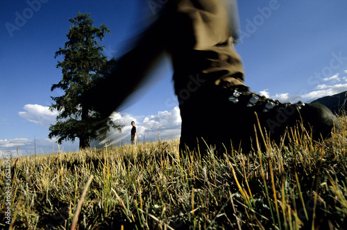A couple hiking across the Atlai Mountains in the Tavanbogd National Park, Mongolia. photo