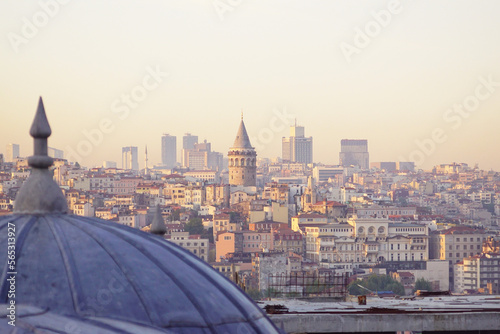 Istanbul cityscape at sunset - the dome of the Suleymaniye mosque complex and a view of the Galata district.