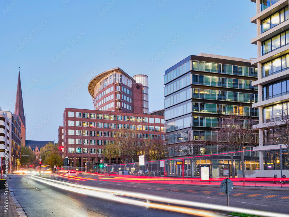Hamburg city buildings and traffic light trails at dusk, Germany