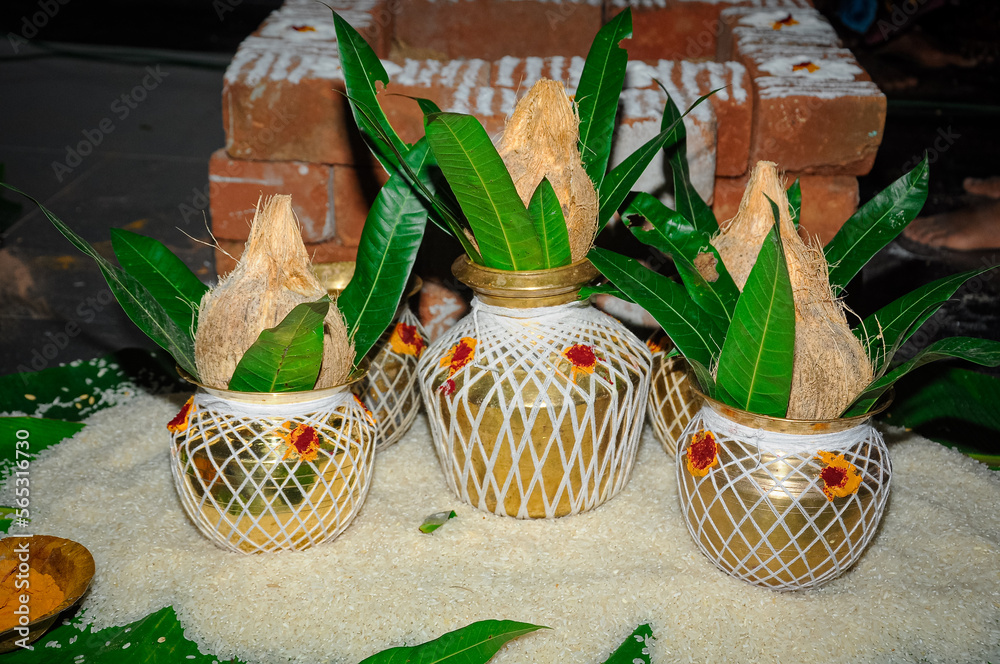 Copper kalash with coconut and mango leaves with white thread