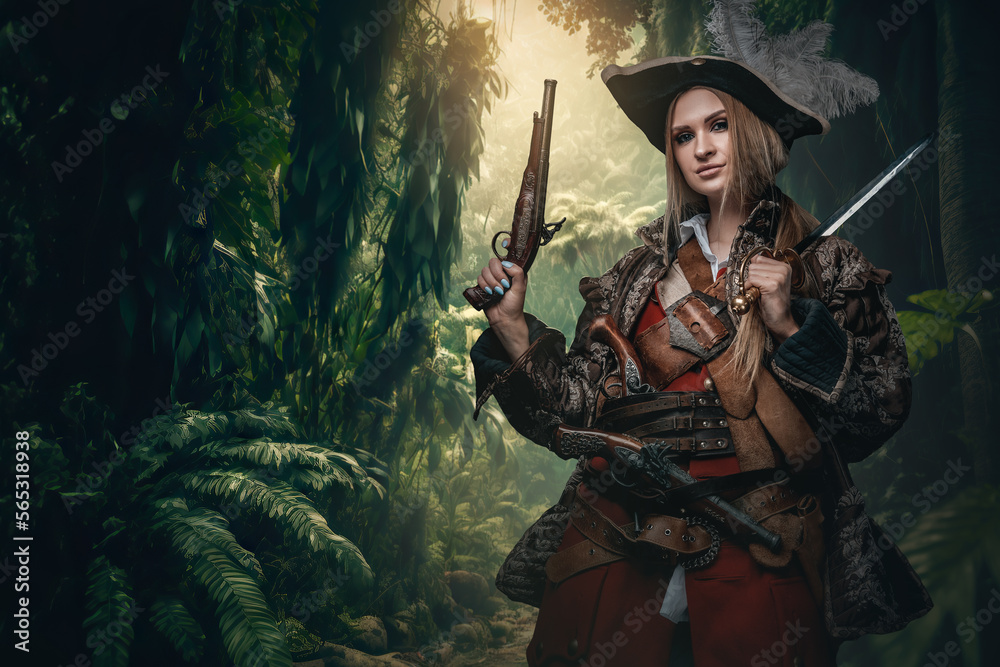Naklejka premium Portrait of buccaneer woman with pistols and hat in jungle of tropical island.