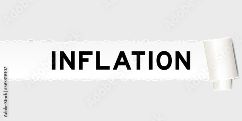 Ripped gray paper background that have word inflation under torn part