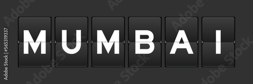Black color analog flip board with word mumbai on gray background