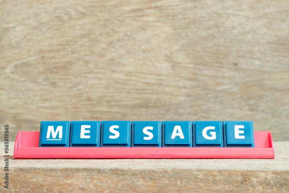 Tile alphabet letter with word message in red color rack on wood background