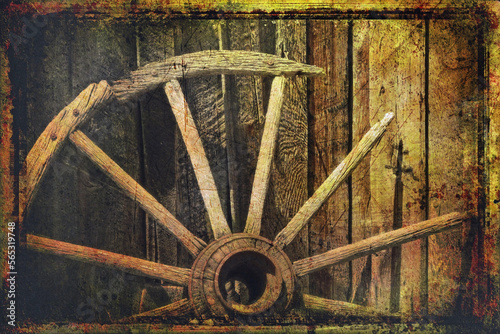 Simulated old victorian photograph of a broken down old wagon wheel against a barn 