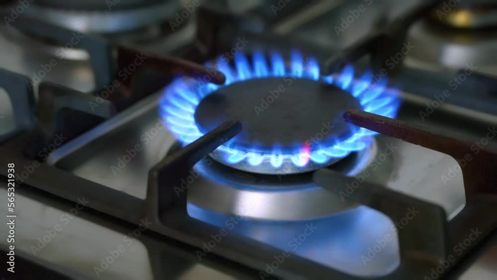 gas stove turns on with burning blue gas flame gas stove turns on with burning blue gas flame
