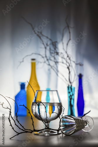 Modern still life with glass bottles and dry branches © 02irina