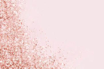 Golden pink sparkles on pink background. Light pink minimalistic festive glamorous background with scattered metal glitter in delicate pastel colors.