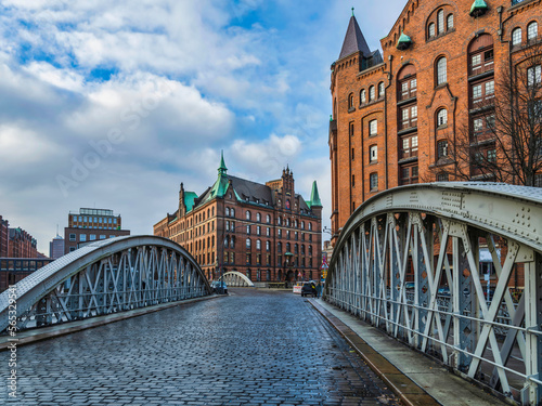 historic Red Brick Buildings and cobblestone streets Neuerwegs bridge on St Annenfleet in Hamburg, Germany