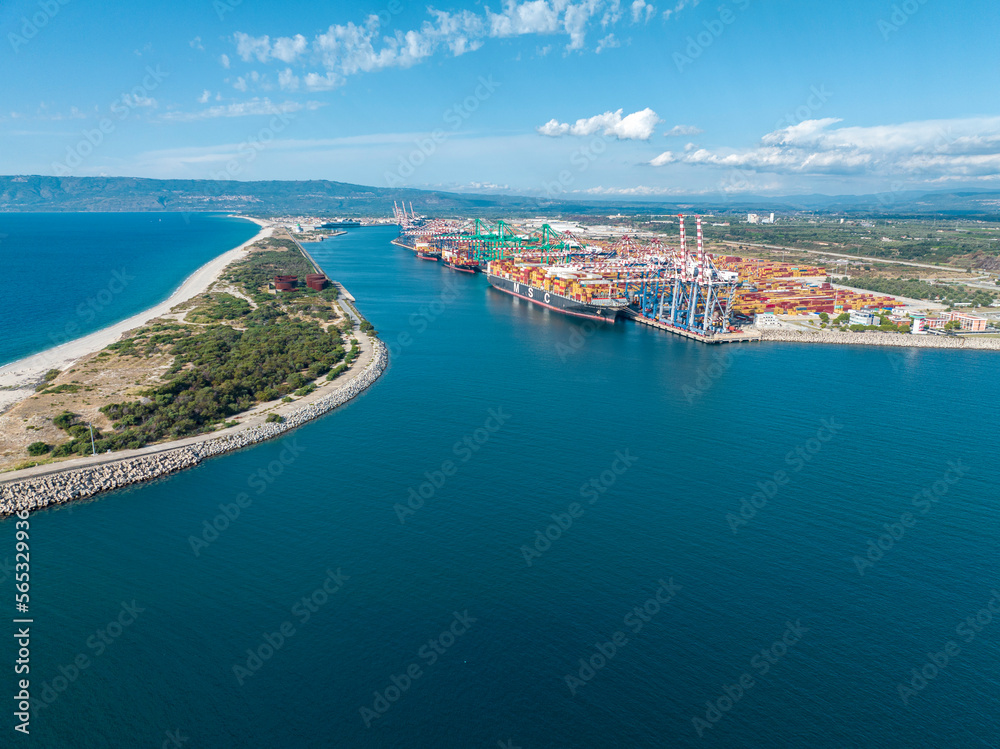 Aerial view of the port of Gioia Tauro, Calabria Italy. Goods loading and unloading operations. Container. Import and export. Global trade. Movement of goods by ship. Transportation. 31-08-2022