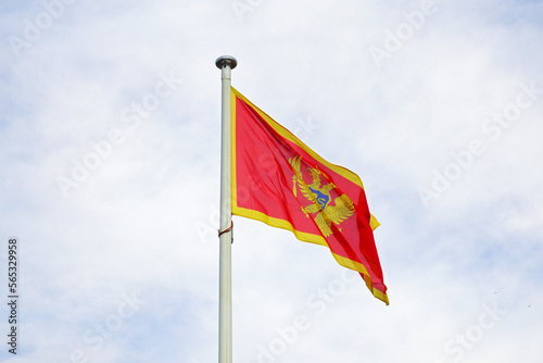 National flag of the country of Montenegro against the sky.