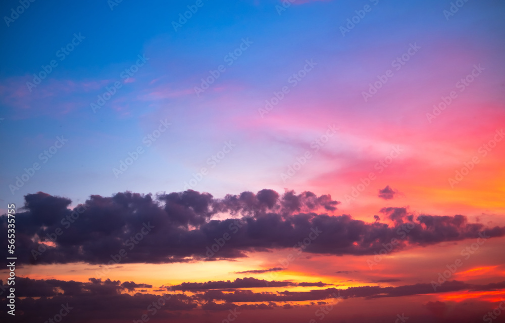 Fototapeta premium beautiful gradient orange and ranibow colour clouds and sunlight on the blue sky perfect for the background, take in everning,Twilight