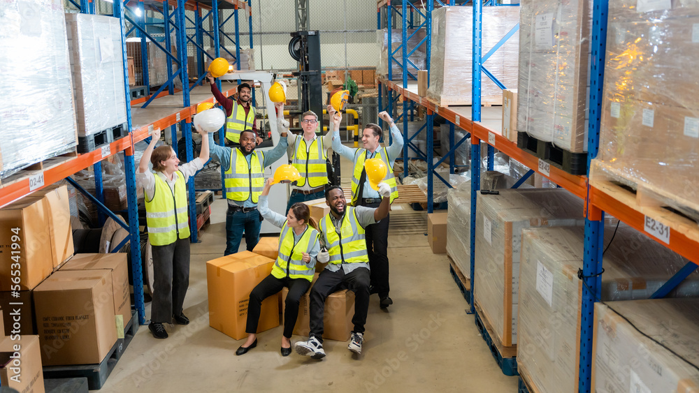 Raised angle portrait group photo of workers inside a food distribution warehouse