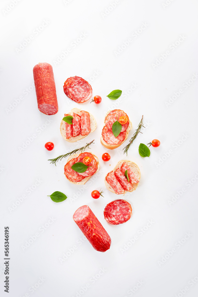 Smoked sausage salami with slices isolated on white background with ...