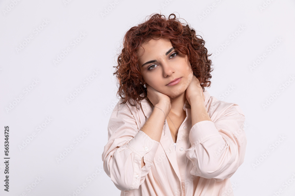 Portrait of a girl with a serious expression on her face. Short curly hair. Portrait of a girl with a serious expression on her face. Short curly hair.