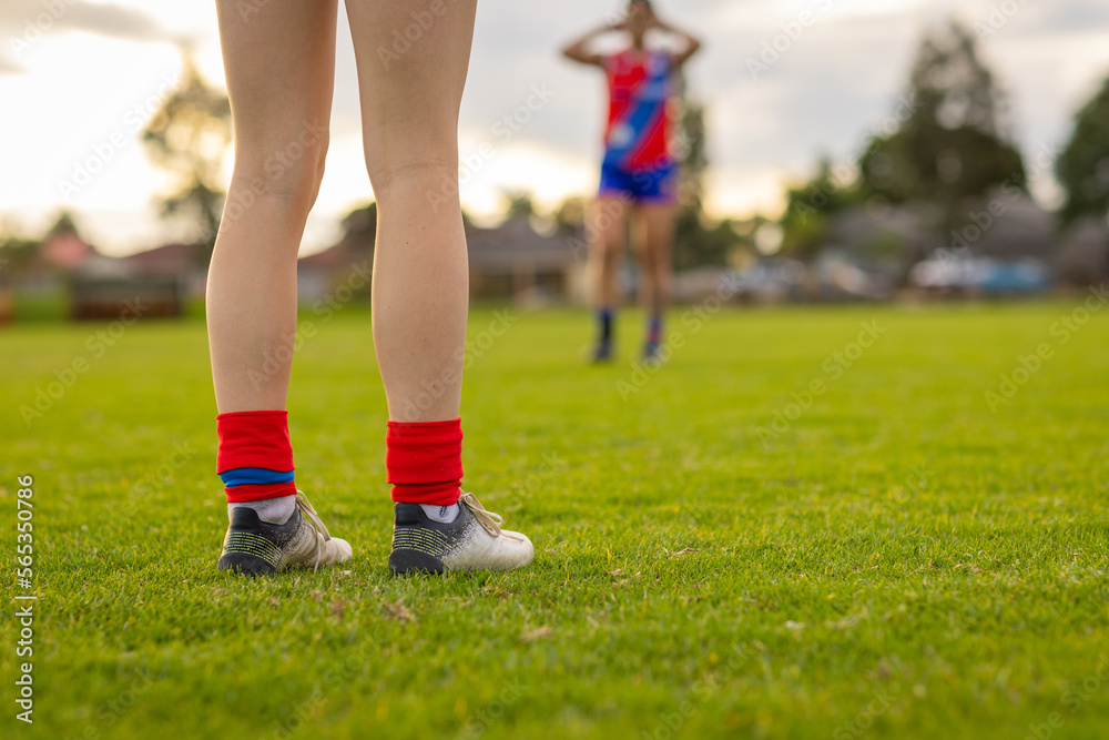low angle shot of football players legs on field low angle shot of football players legs on field