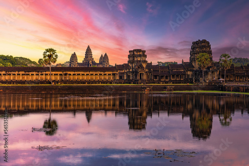 Angkor Wat temple reflecting in water of Lotus pond at sunset