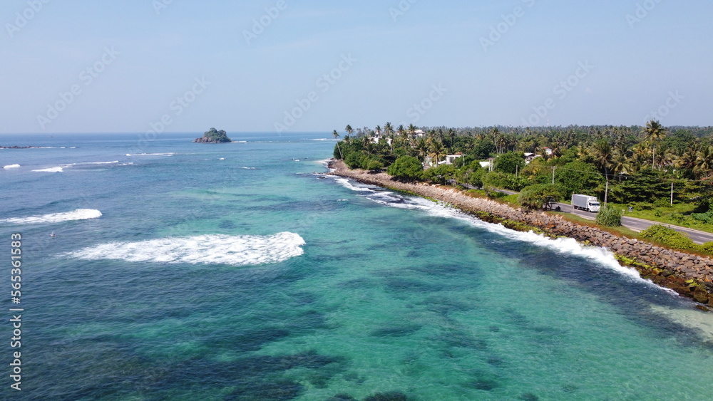 Sri Lanka Southern beaches captured by a drone. Indian blue ocean with clear blue sky, warm tropical temperature, Sri Lanka Southern beaches captured by a drone. Indian blue ocean with clear blue sky, warm tropical temperature,