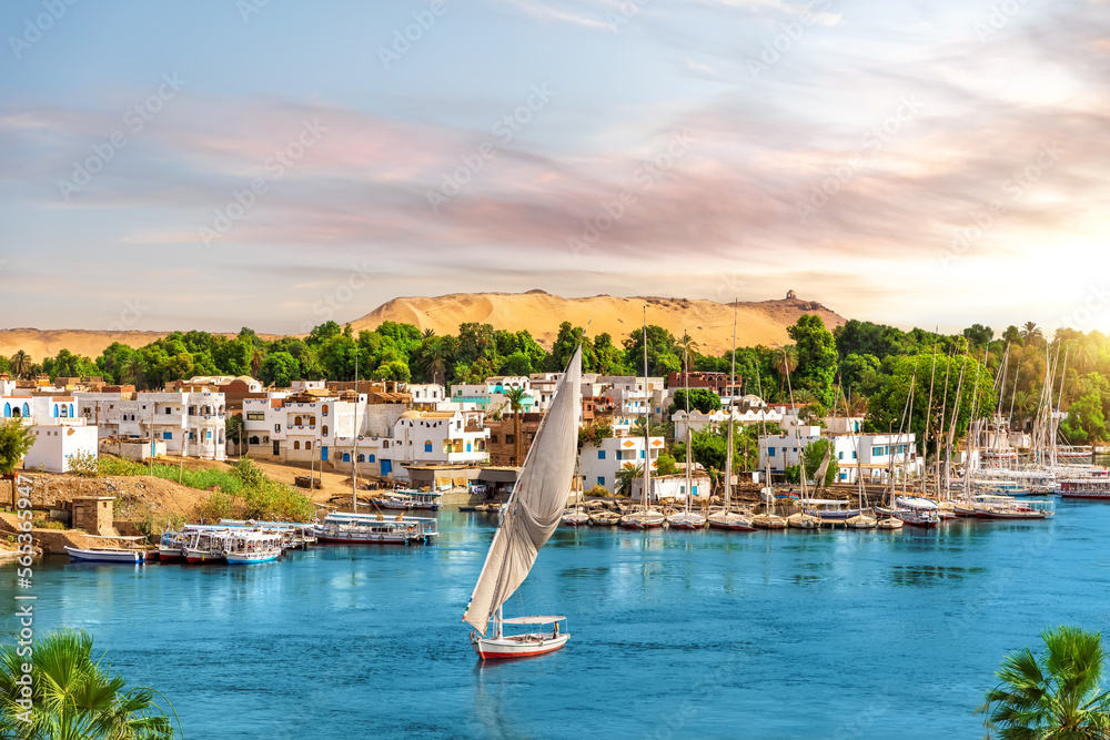 Picturesque buildings of Aswan, the Nile and sailboats, Egypt