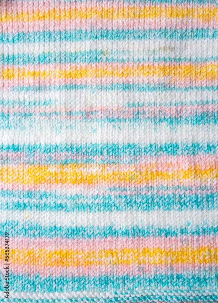 Knitted texture. Pattern fabric made of wool. Background, copy space. Handmade sweater texture, knitted wool pattern