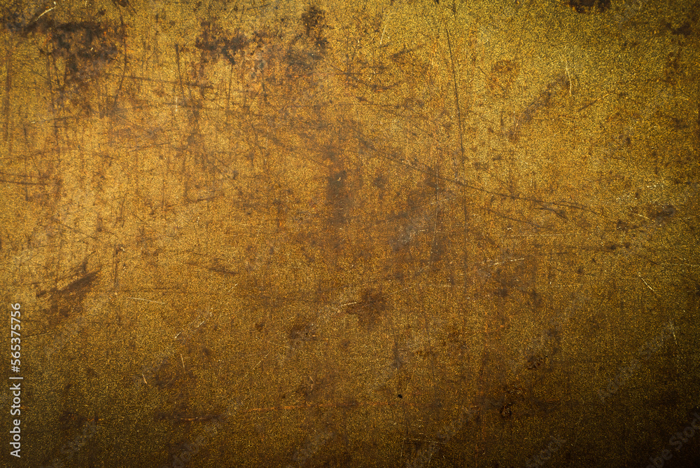 Texture or background of metal with rust and scuffs. Material gold