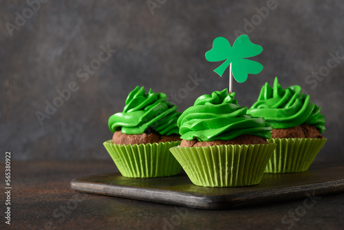 Wallpaper Mural St. Patrick's Day homemade cupcakes with green whipped cream decorated shamrock and clover on brown background. Close up. Copy space. Good luck. Torontodigital.ca