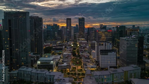 Experience the beauty of Bonifacio Global City from a bird's eye view in this aerial drone timelapse of a golden hour sunset in Metro Manila, Philippines. photo
